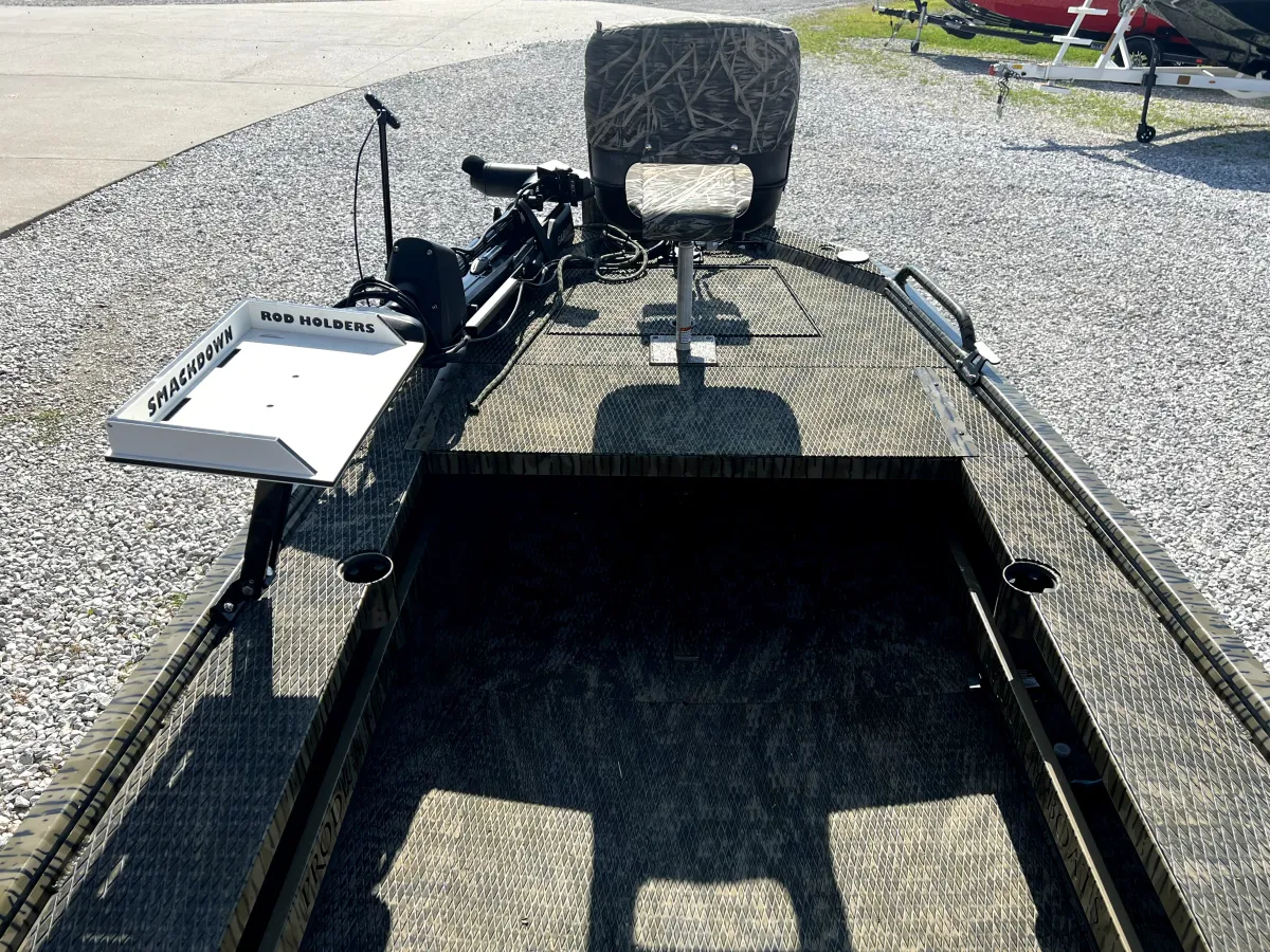 Interior helm console of the 2023 Prodigy Villain 1751 with ergonomic helm seat and touchscreen controls, presented in used condition at Waypoint Marine