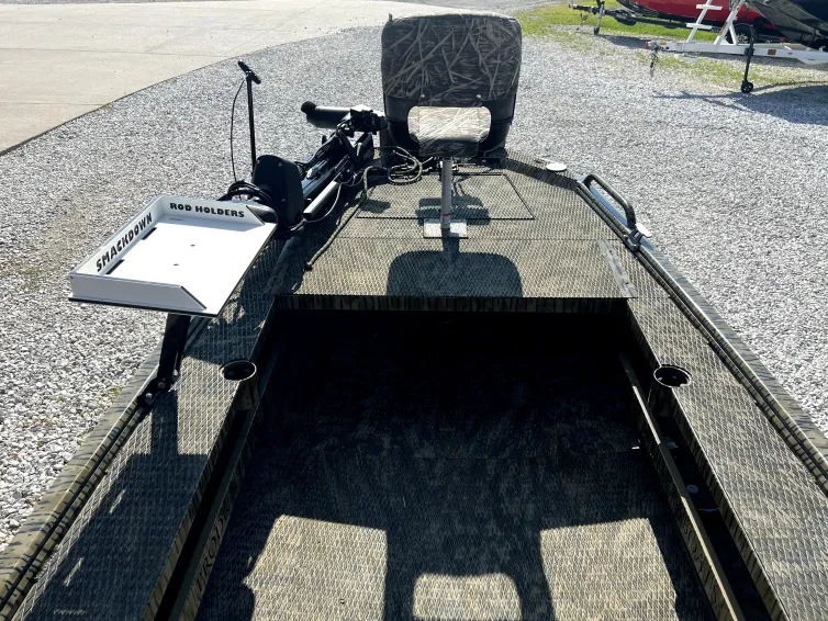 Interior helm console of the 2023 Prodigy Villain 1751 with ergonomic helm seat and touchscreen controls, presented in used condition at Waypoint Marine