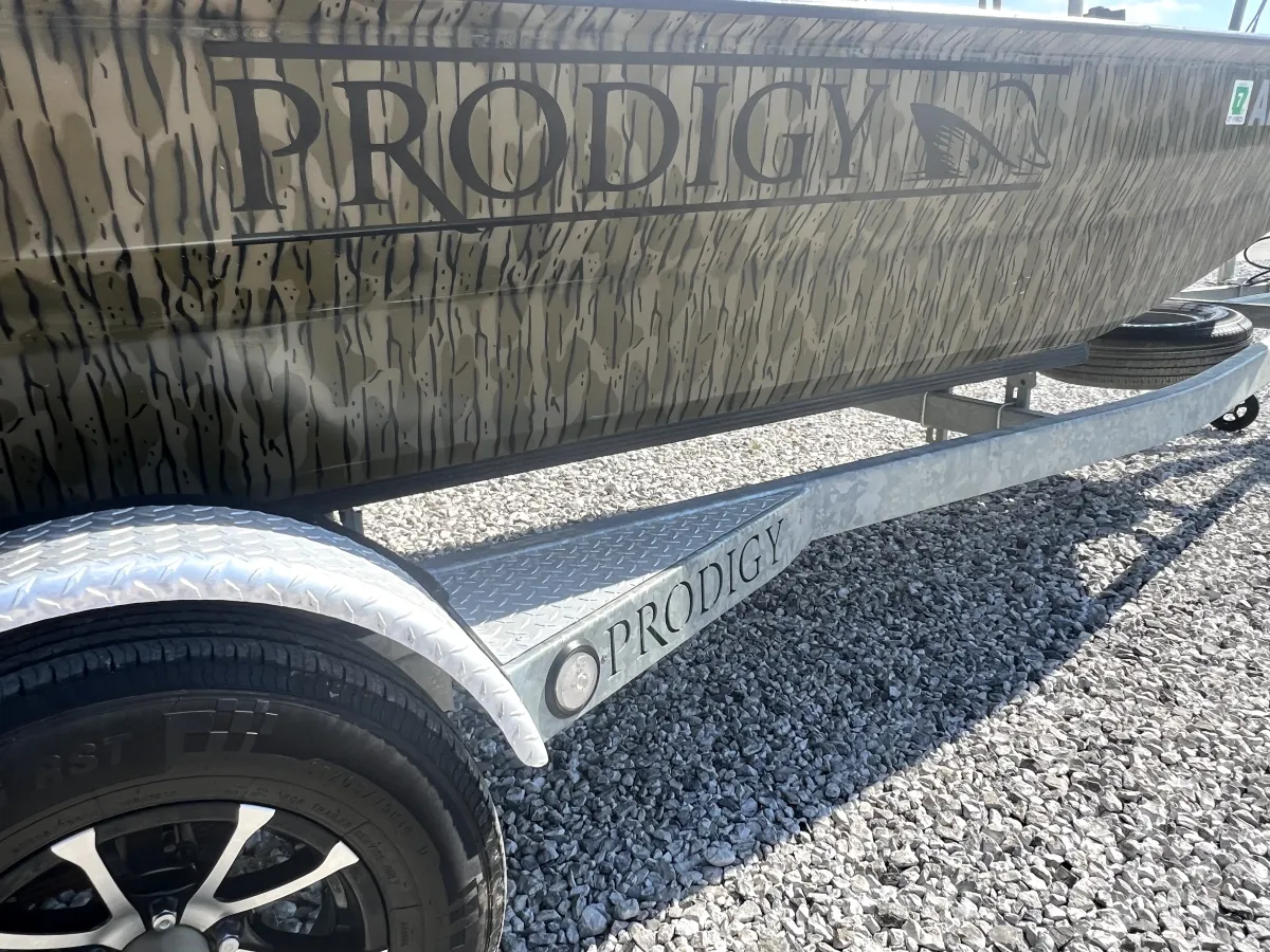 Rear transom of the 2023 Prodigy Villain 1751 featuring integrated swim platform, ladder, and storage hatches, photographed at Waypoint Marine