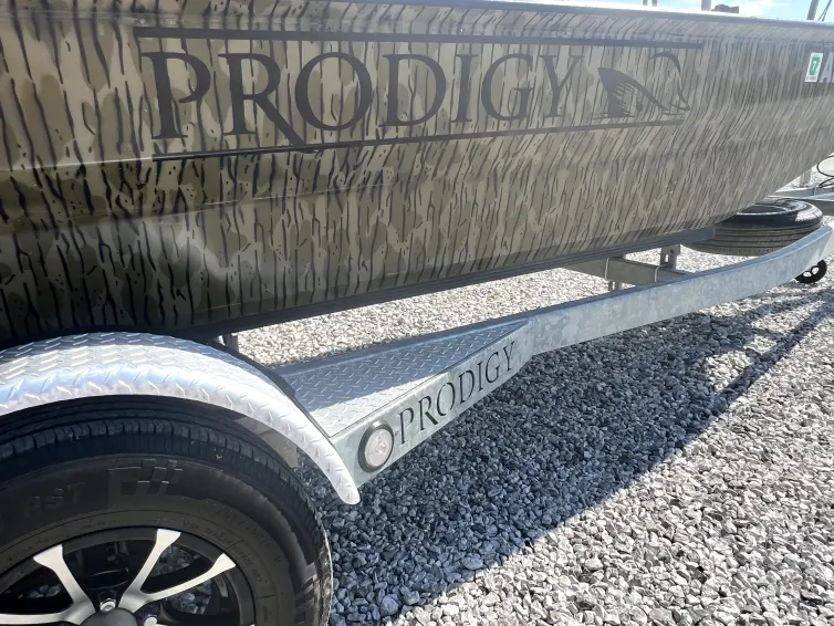 Rear transom of the 2023 Prodigy Villain 1751 featuring integrated swim platform, ladder, and storage hatches, photographed at Waypoint Marine